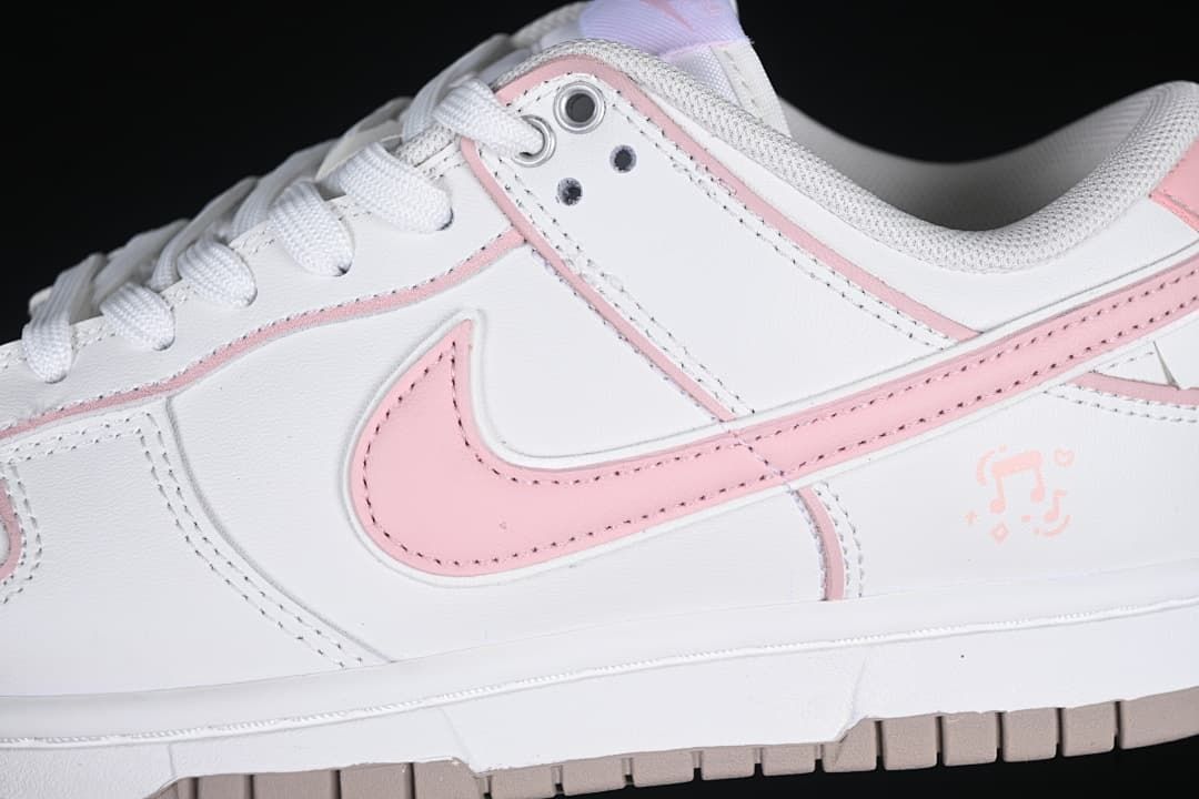 Close-up of pink side Swoosh and white upper
