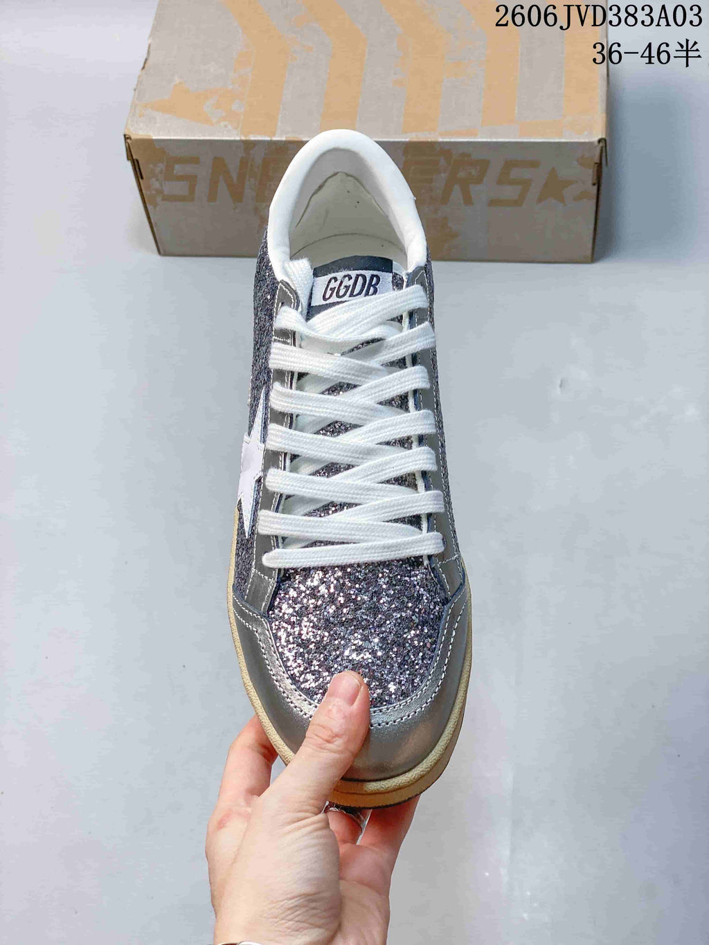 Top view showing white laces and a glitter-finish toe panel