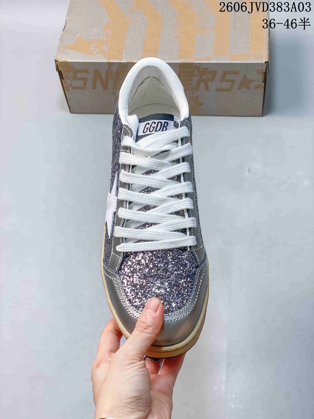 Top view showing white laces and a glitter-finish toe panel