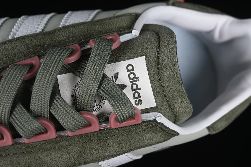Close-up of green laces and pink lace loops
