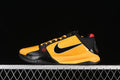 Side view of yellow and black Nike Kobe 5 basketball shoes with red accents