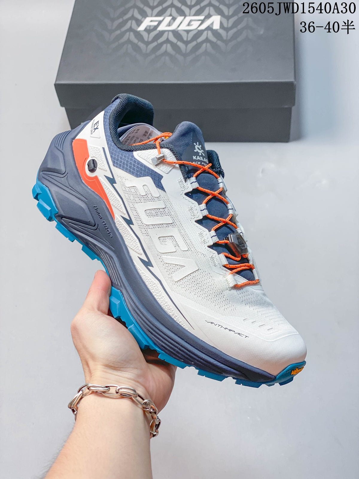 Purple and white Kailas FUGA low-top shoe with yellow laces and a dark blue tongue.