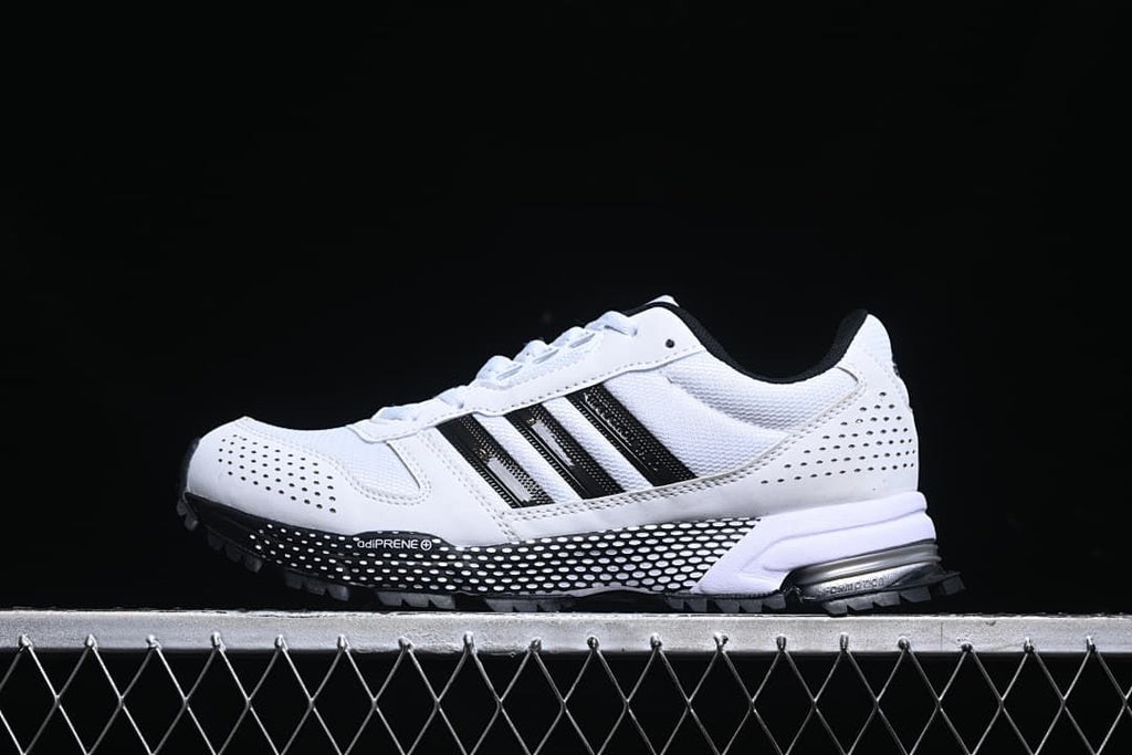 Side view of white and black adidas D96615 sneakers