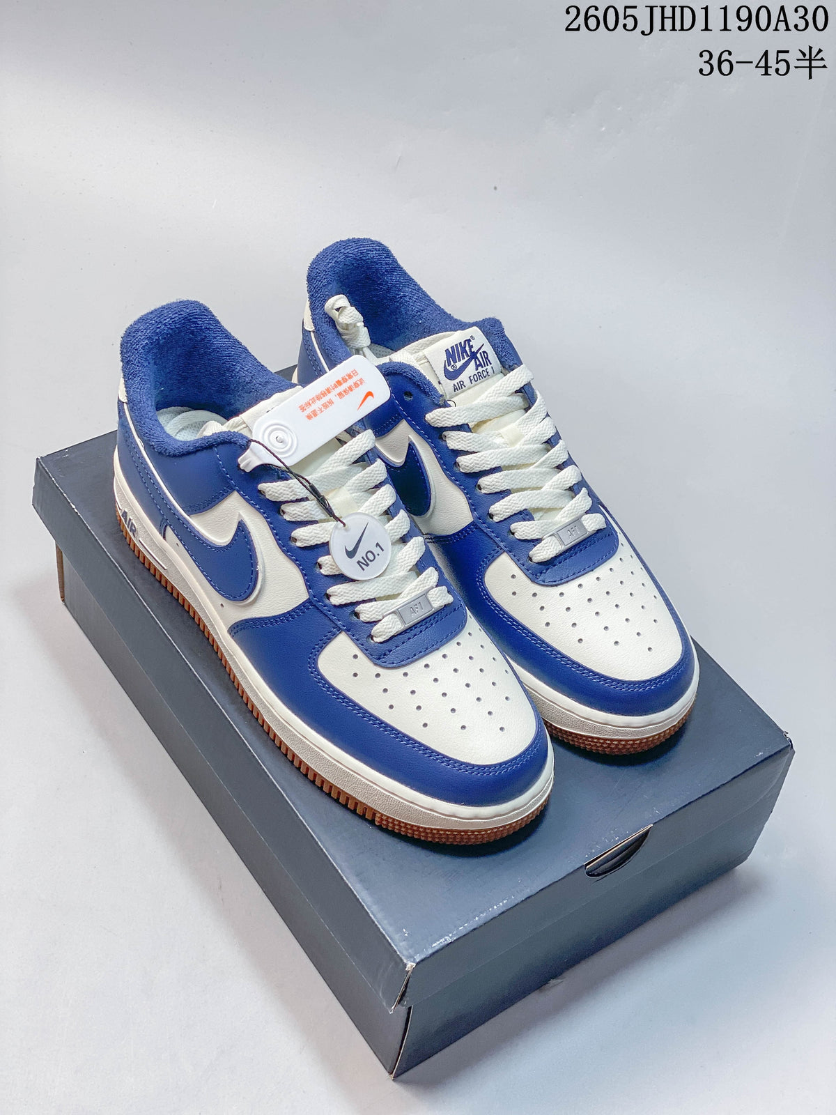 Blue and white Nike Air Force 1 ’07 LV8 low-top sneakers displayed on a shoe box.