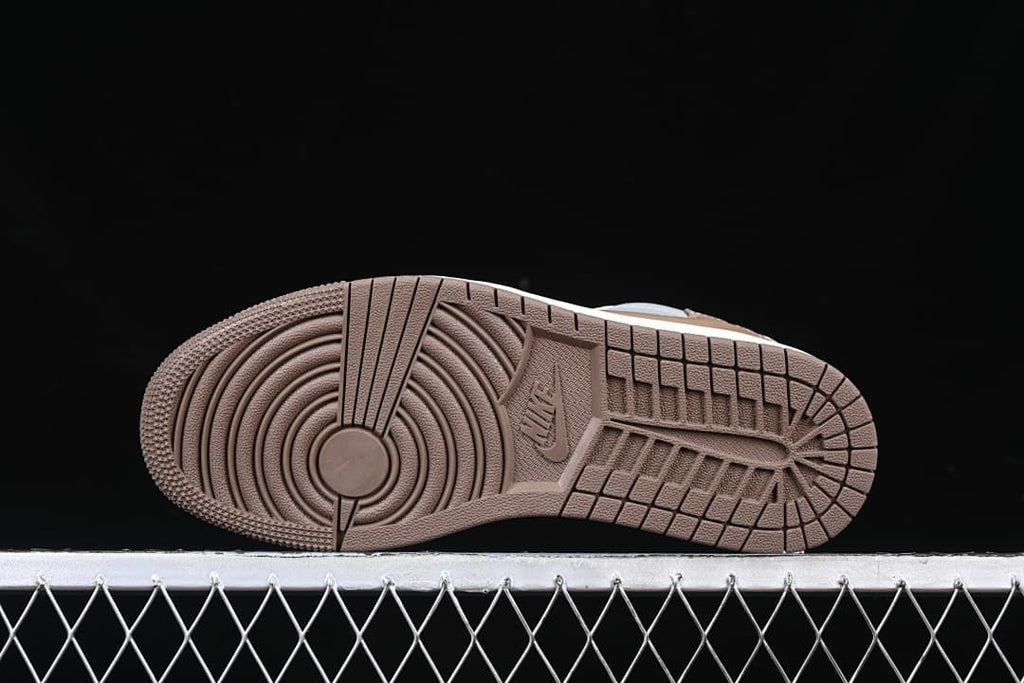 Underside view showing the brown patterned outsole.