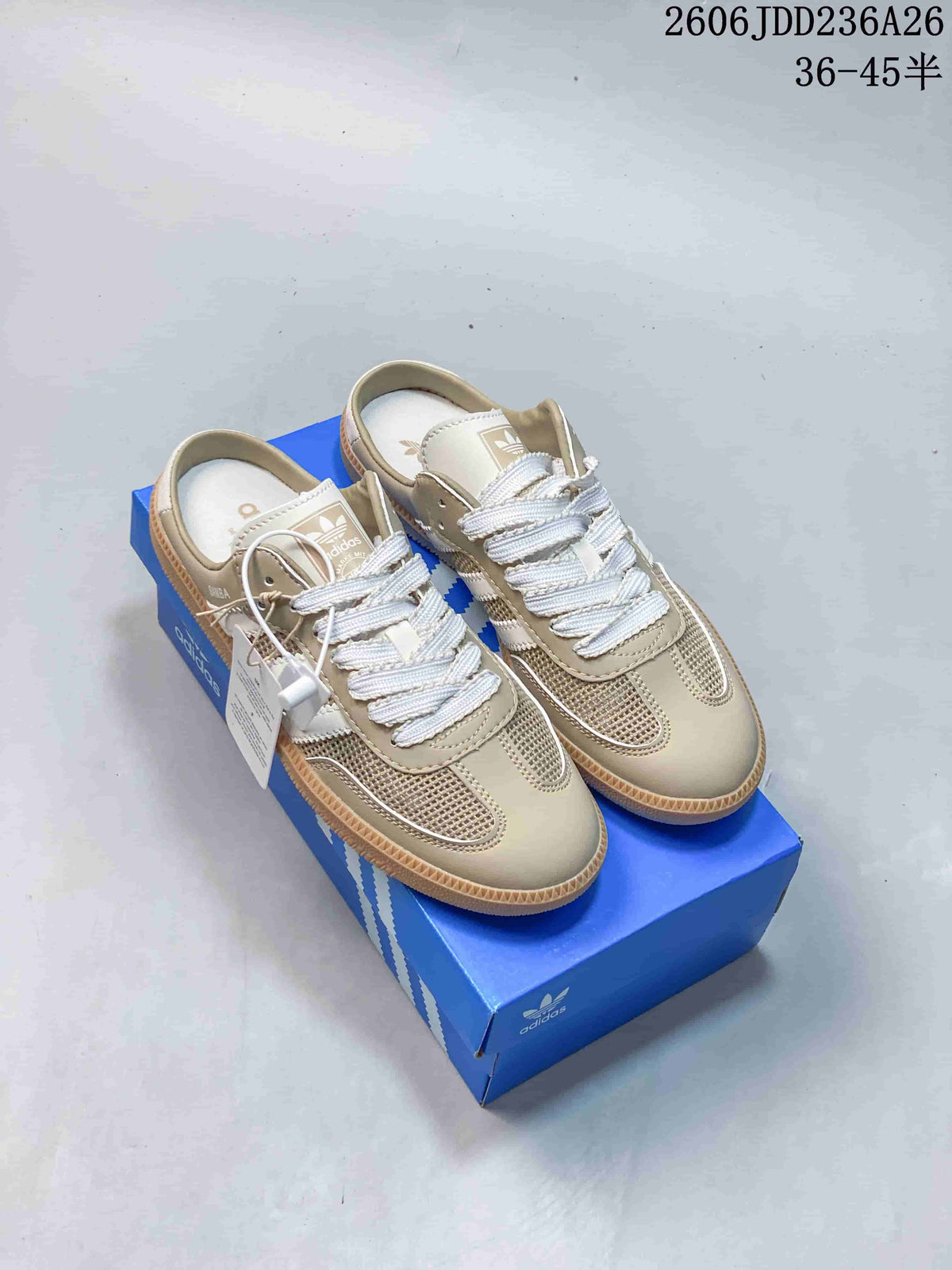 Pair of beige-toned Samba-style low-top mule sneakers with mesh panels and gum-colored soles