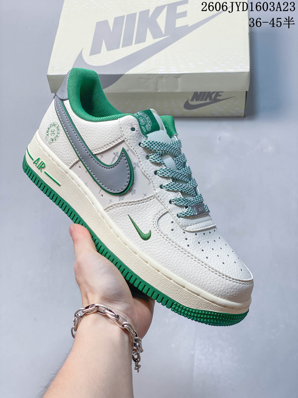 Angled side view of the sneaker with gray and green accents.
