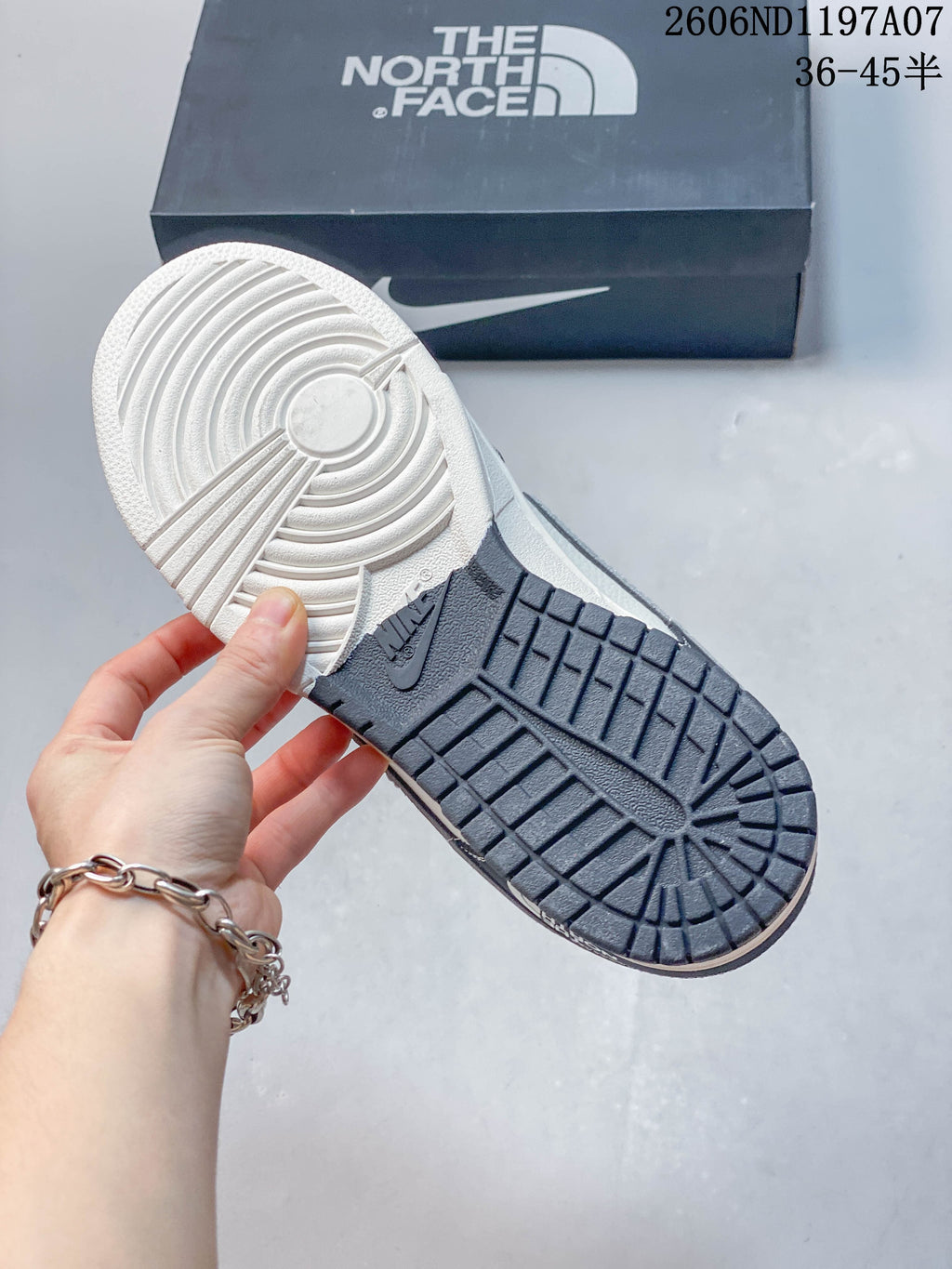 Close-up of the sneaker outsole showing a two-tone tread pattern