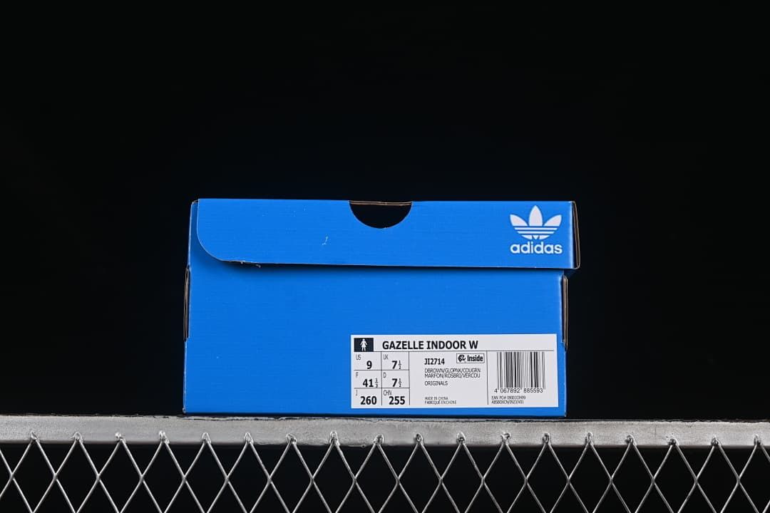Blue adidas shoe box with a visible Gazelle Indoor W label and model code JI2714; the pictured box label shows US 9 and FR 41⅓.