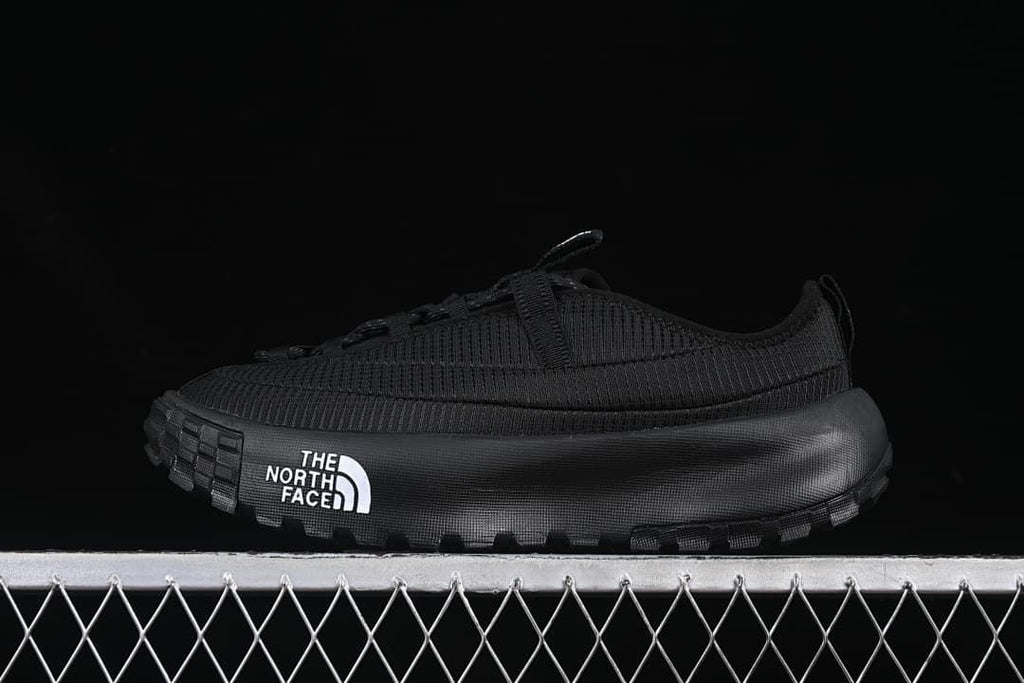 Side view of a black The North Face Never Stop low-top shoe