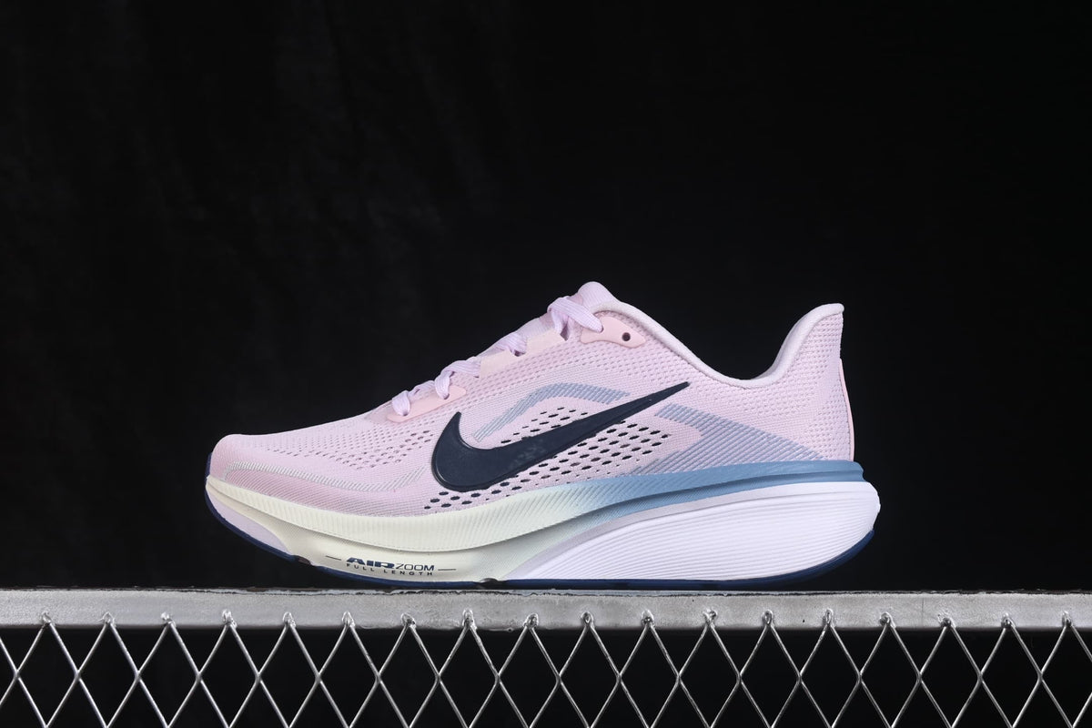Opposite side profile showing the mesh upper, navy Swoosh, blue accent, and layered sole.