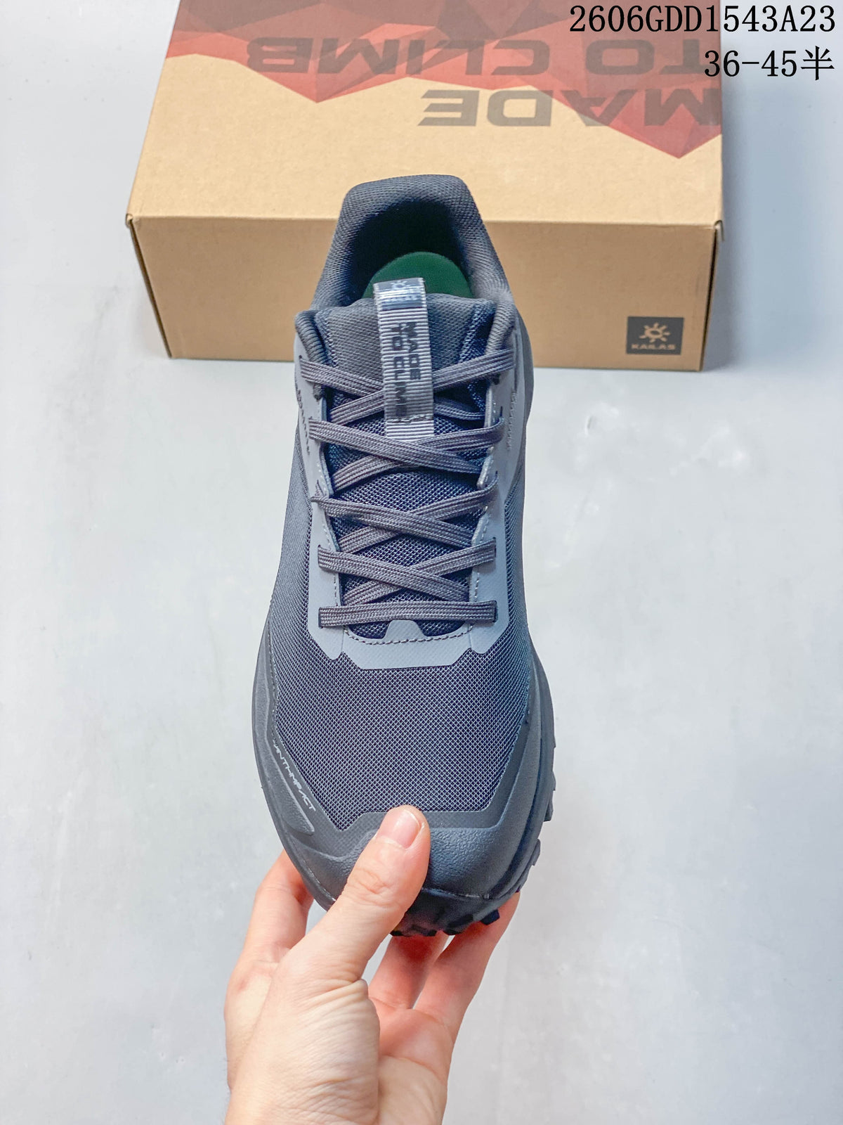 Top view of gray lace-up trail running shoe