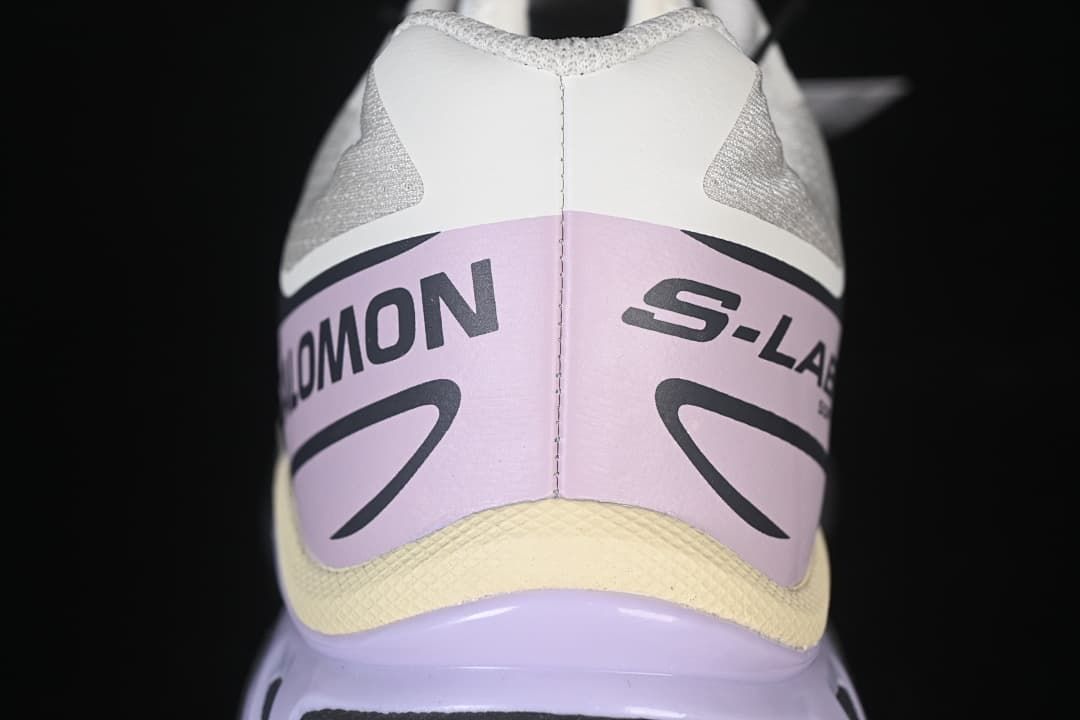 Rear view showing lilac heel panels and pale yellow accent trim