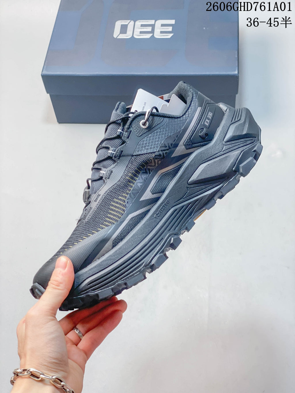 Side view showing the shoe profile, quick-lacing system, and lugged outsole