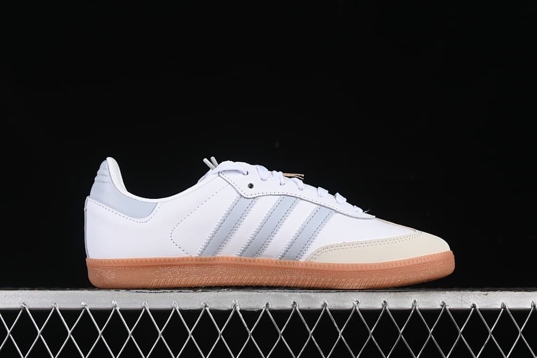 Side profile of the white and grey sneaker with gum sole