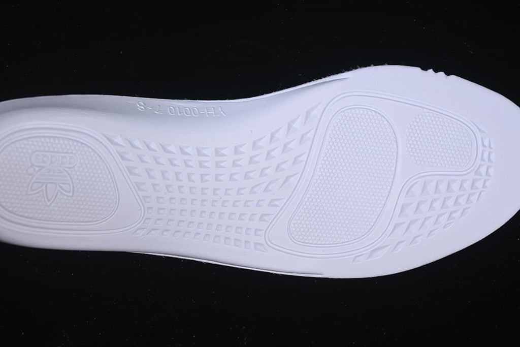 Underside of the sneaker showing the molded outsole tread.