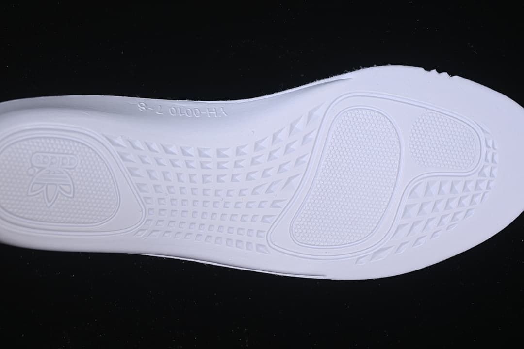 Underside of the sneaker showing the molded outsole tread.