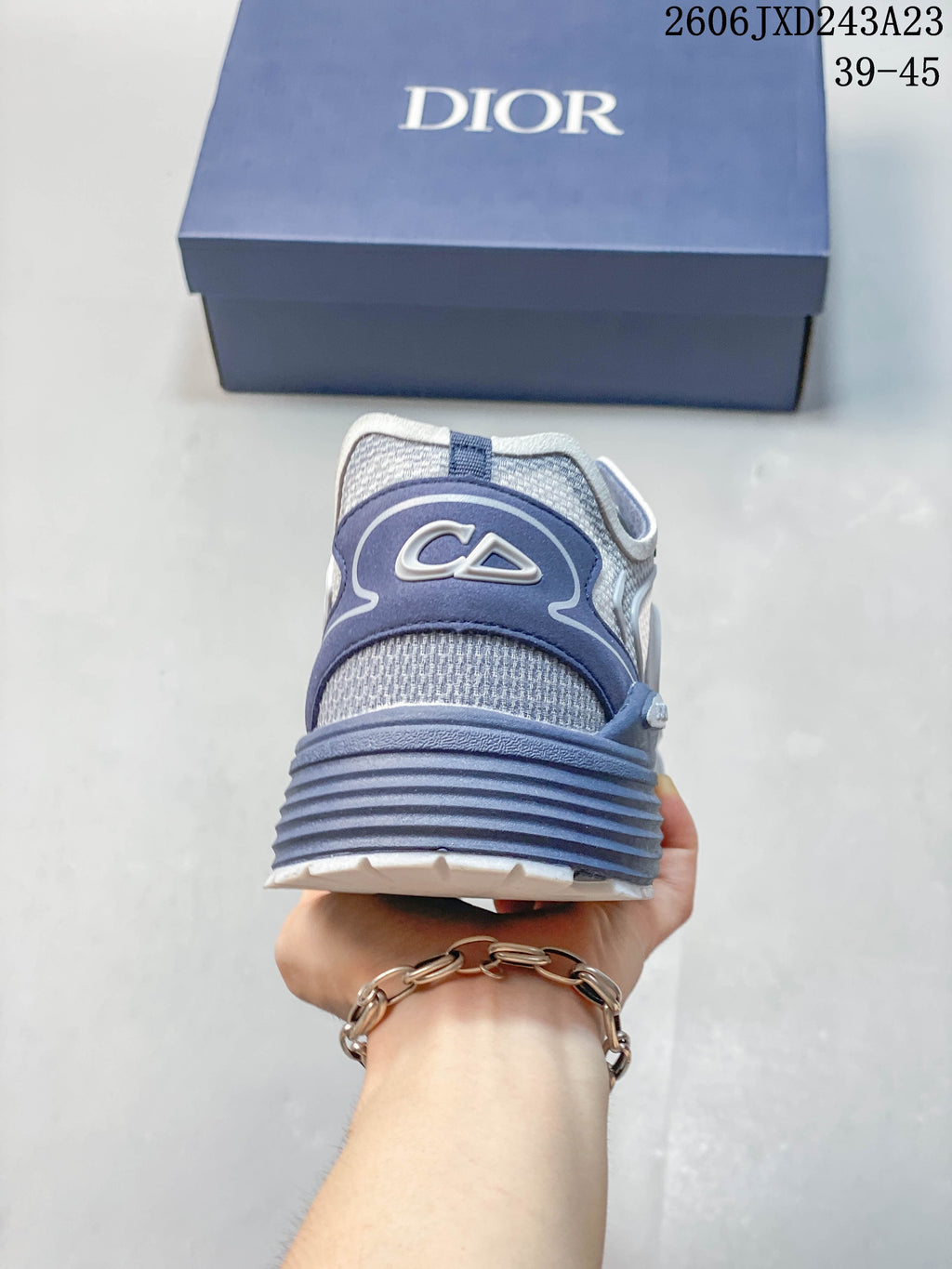 Rear view of the gray and blue sneaker showing the heel design