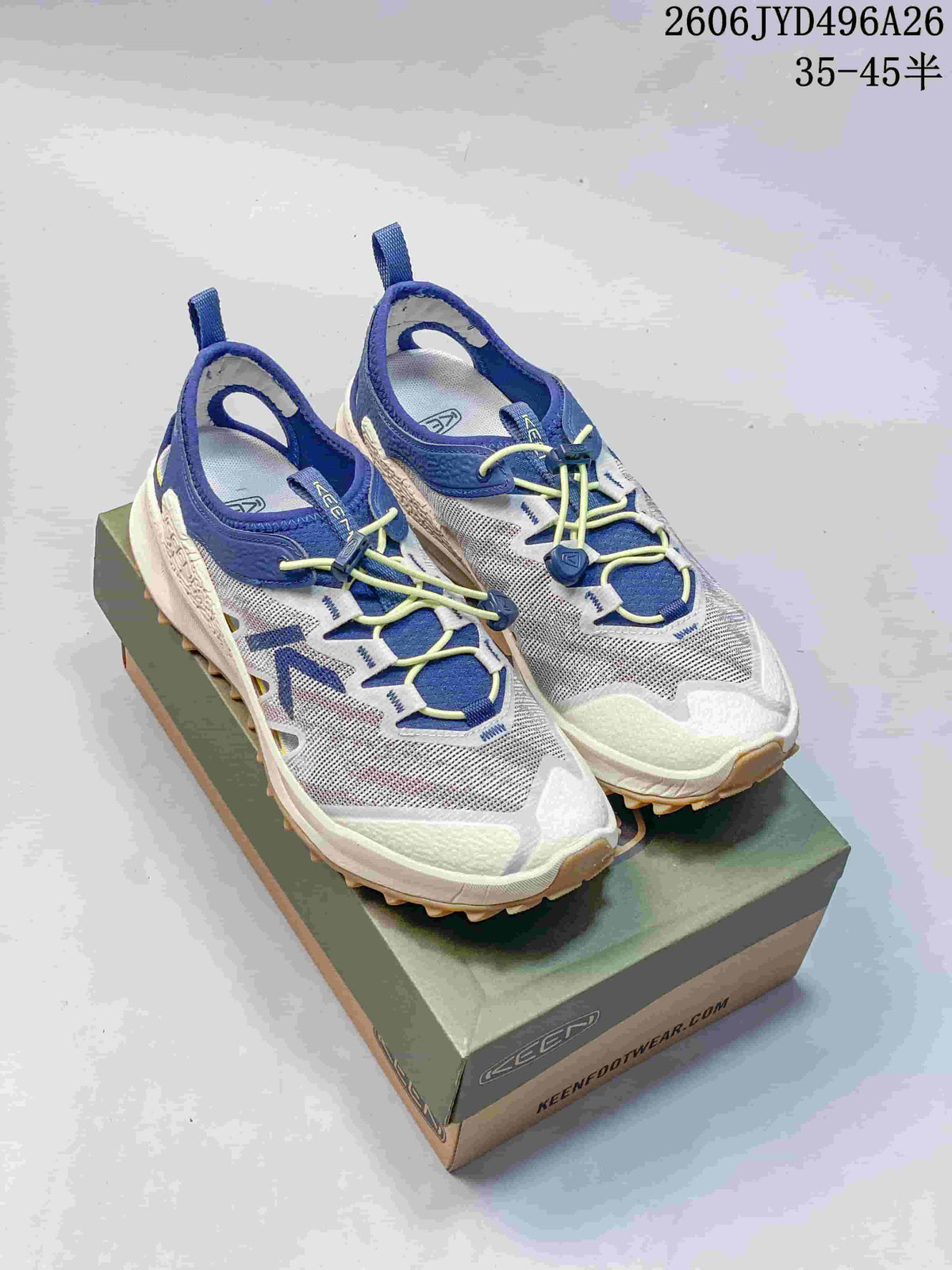 Pair of white low-top hiking shoes with blue and yellow accents