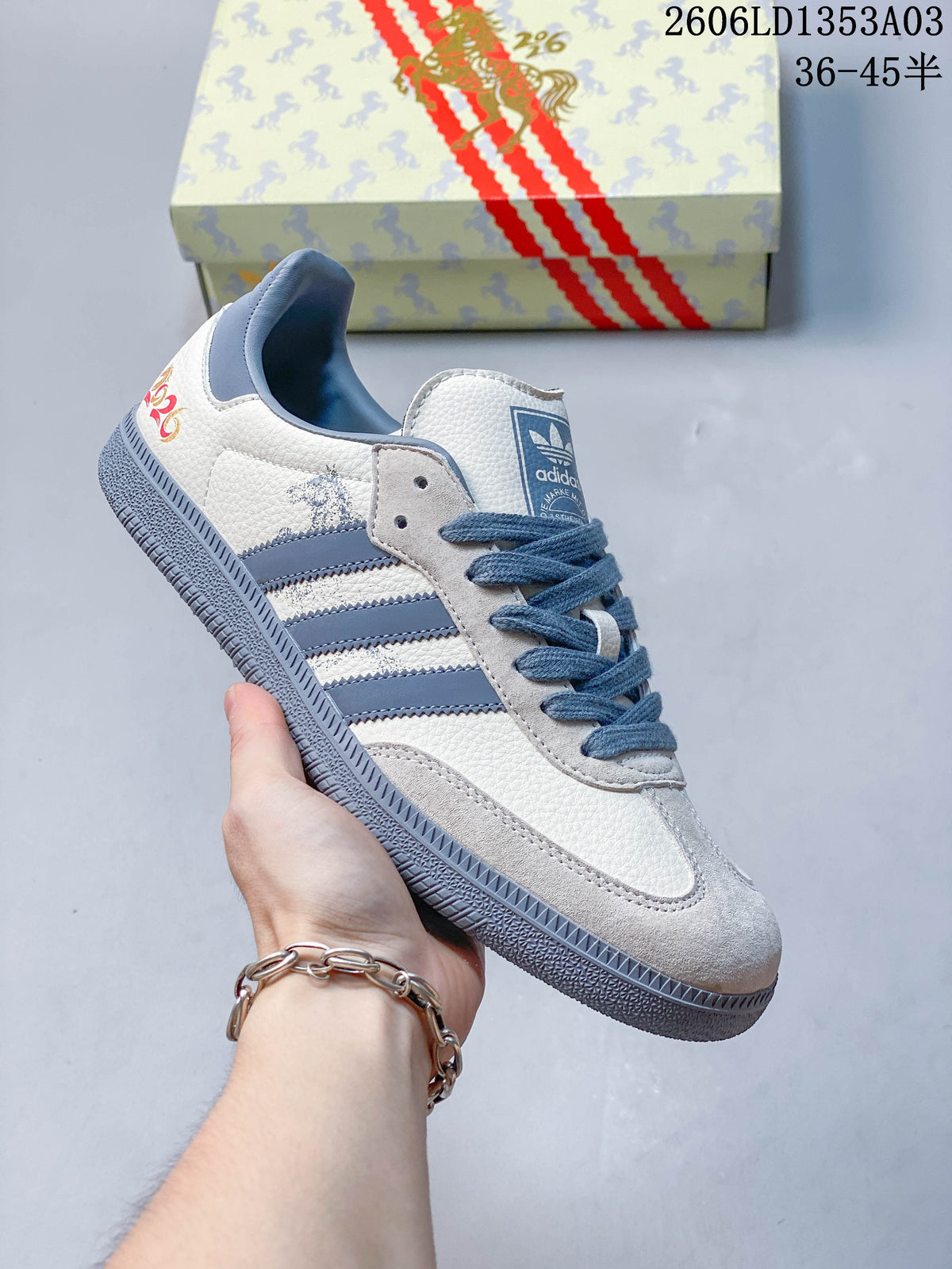 White Gazelle Indoor sneaker with blue accents, horse-themed box, and size range printed in the image.