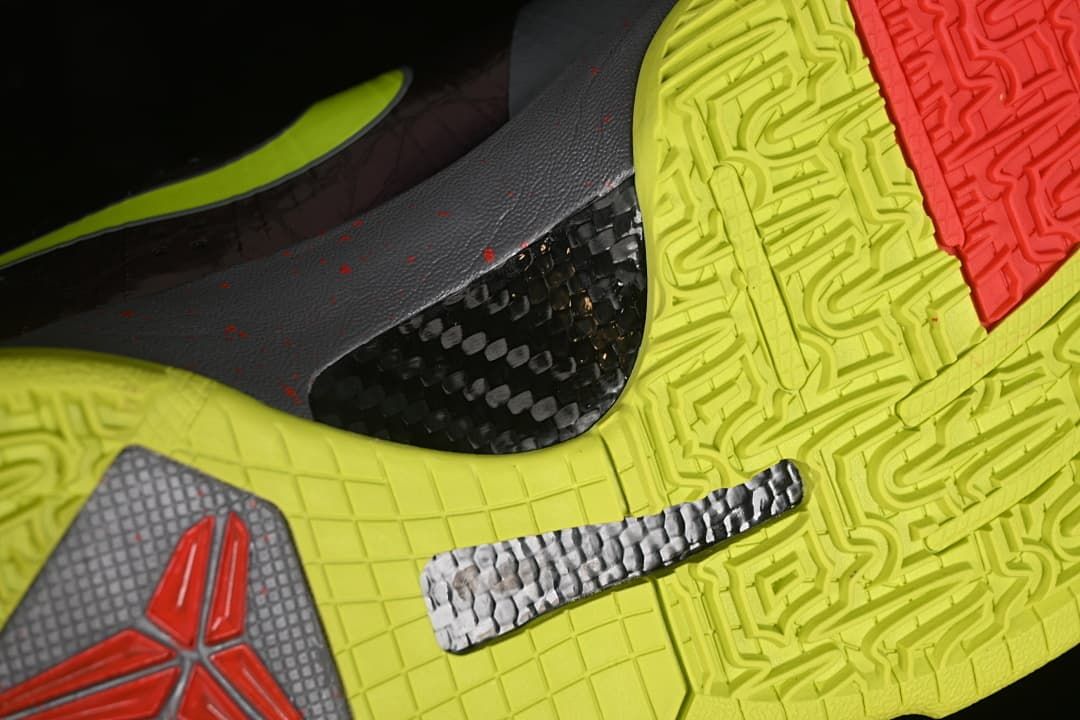 Close-up of bright yellow outsole tread and midfoot detail