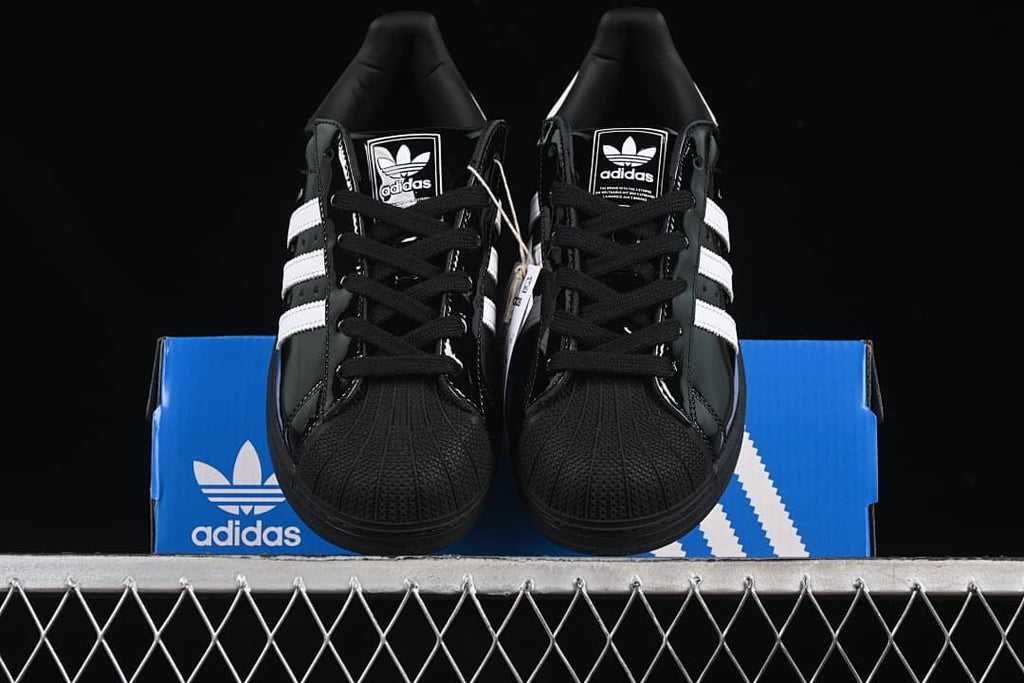 Front view of the pair showing the shell toes, laces and white stripes