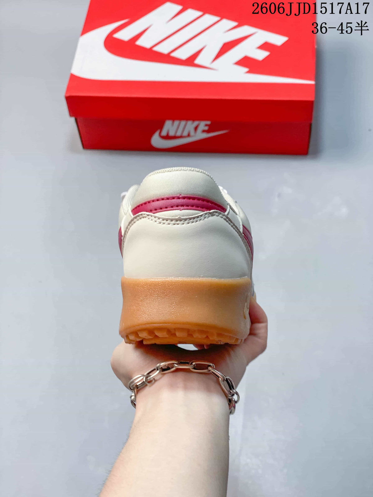 Rear view of a Nike Terra Manta sneaker showing its cream upper and gum-colored heel outsole