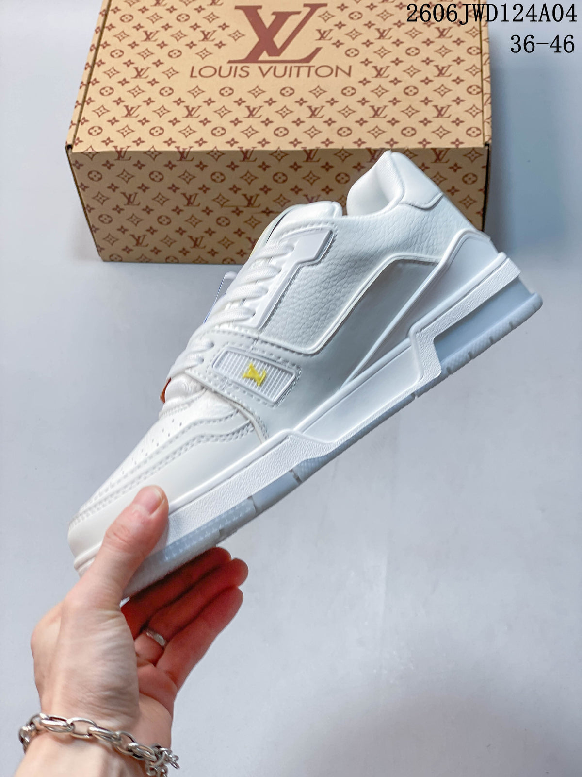 Side profile of a white low-top sneaker showing its layered sole and perforated toe.