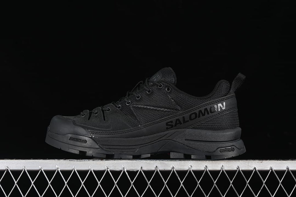 Black Salomon sneaker displayed in side profile