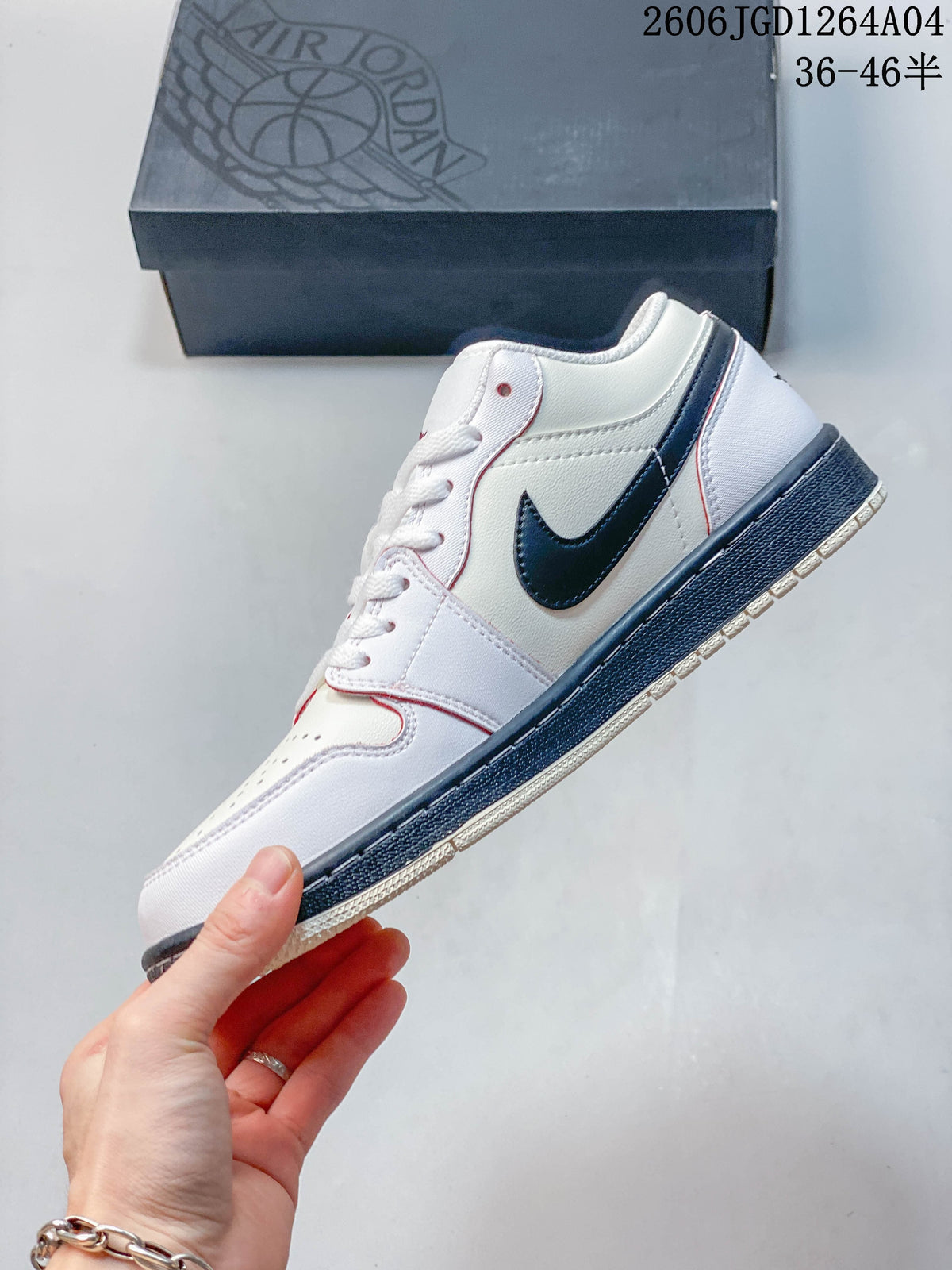 Side profile of the white low-top sneaker with navy Swoosh and red trim