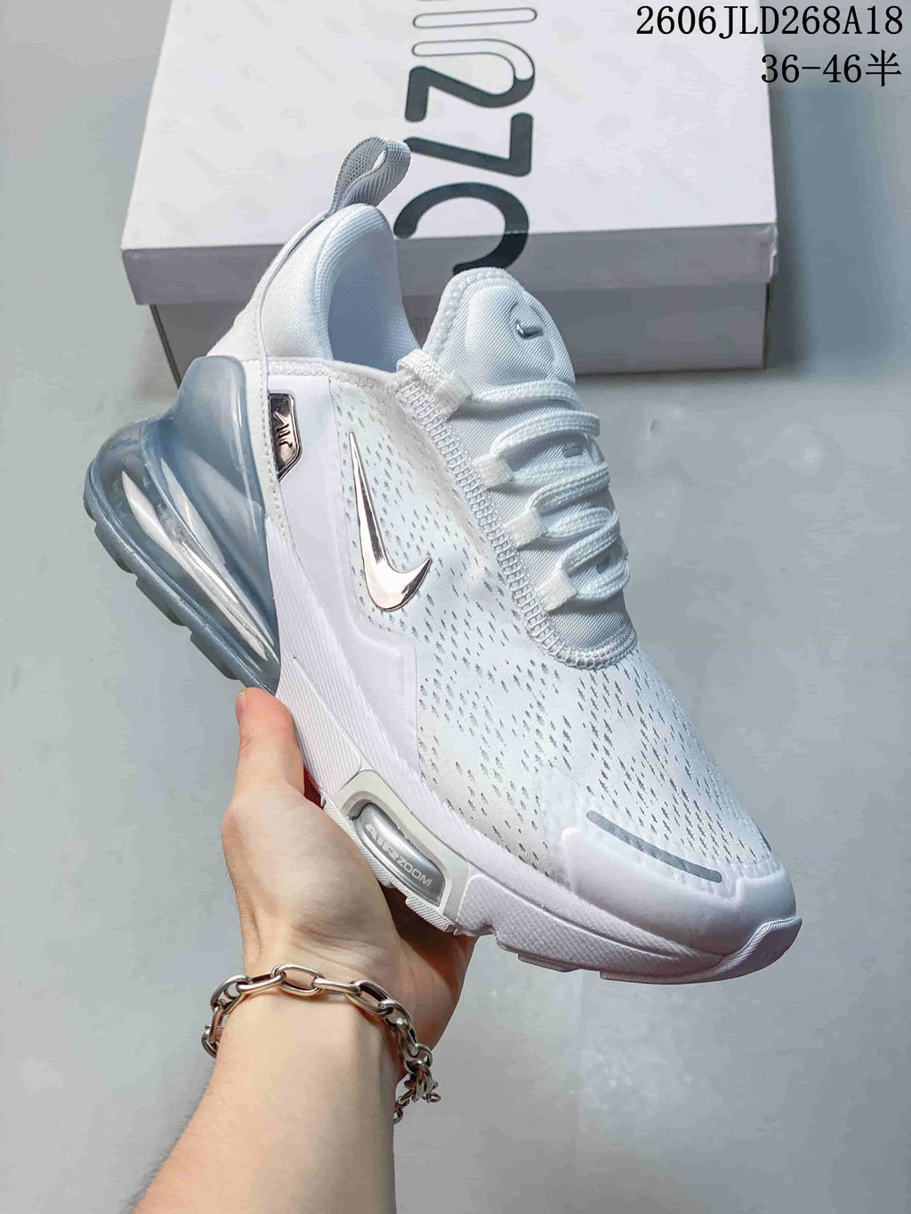 Angled side view of a white Nike Air Max Pulse shoe