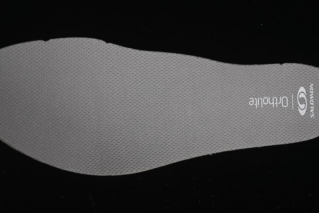 Close-up of a gray Salomon Ortholite insole.