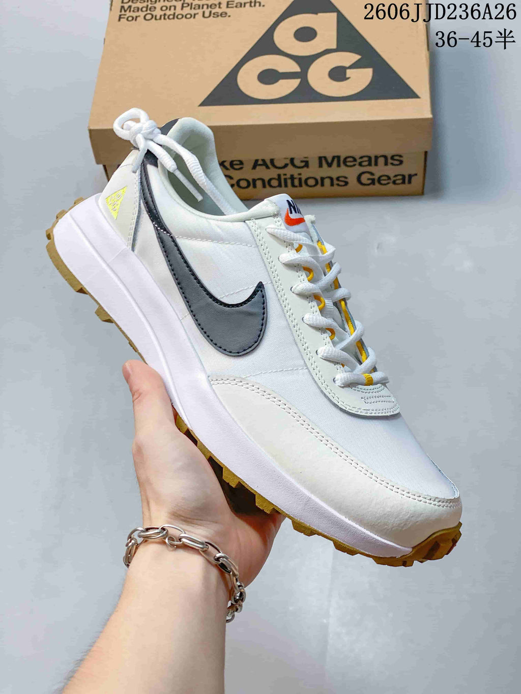 White Nike ACG LDV sneaker shown from the side with dark accents and a lugged outsole.
