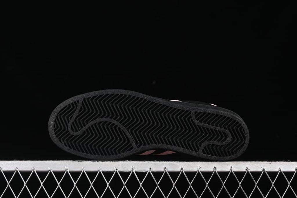 Underside of the sneaker showing a black herringbone-pattern outsole