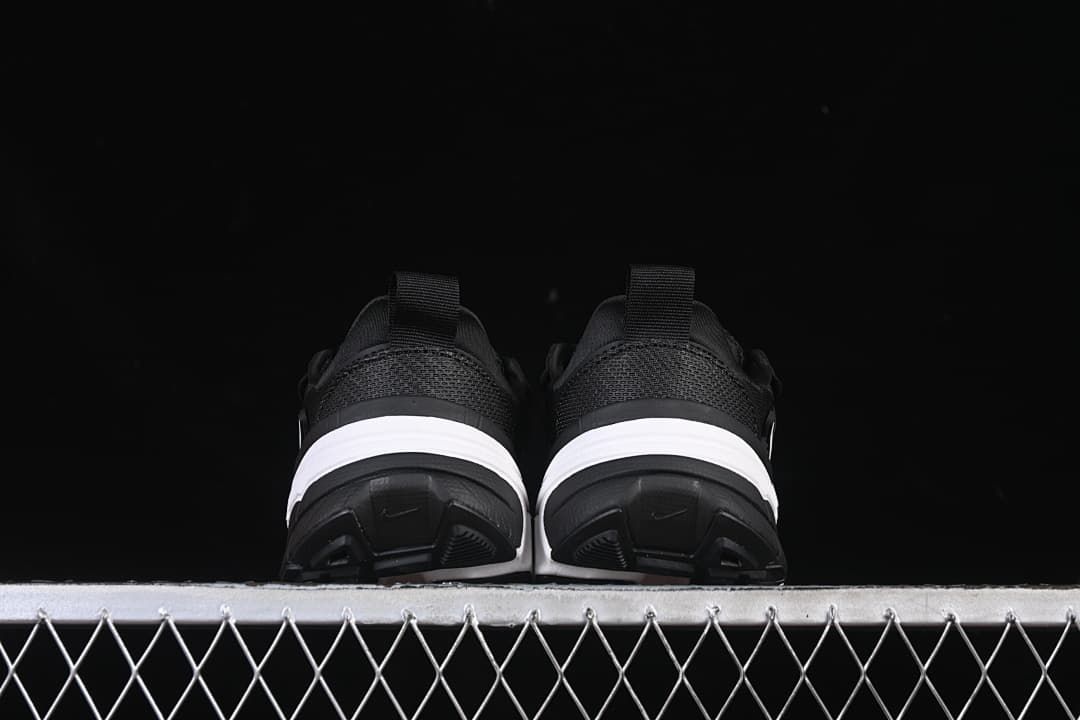 Rear view of both shoes showing their heel panels and soles.
