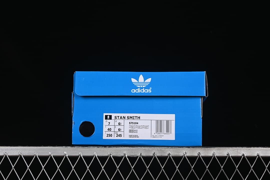 Blue shoe box label identifying Stan Smith and product code S75104