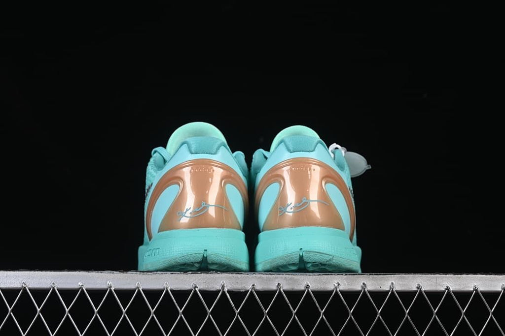 Rear view of the pair with copper-toned heel panels and signature details.