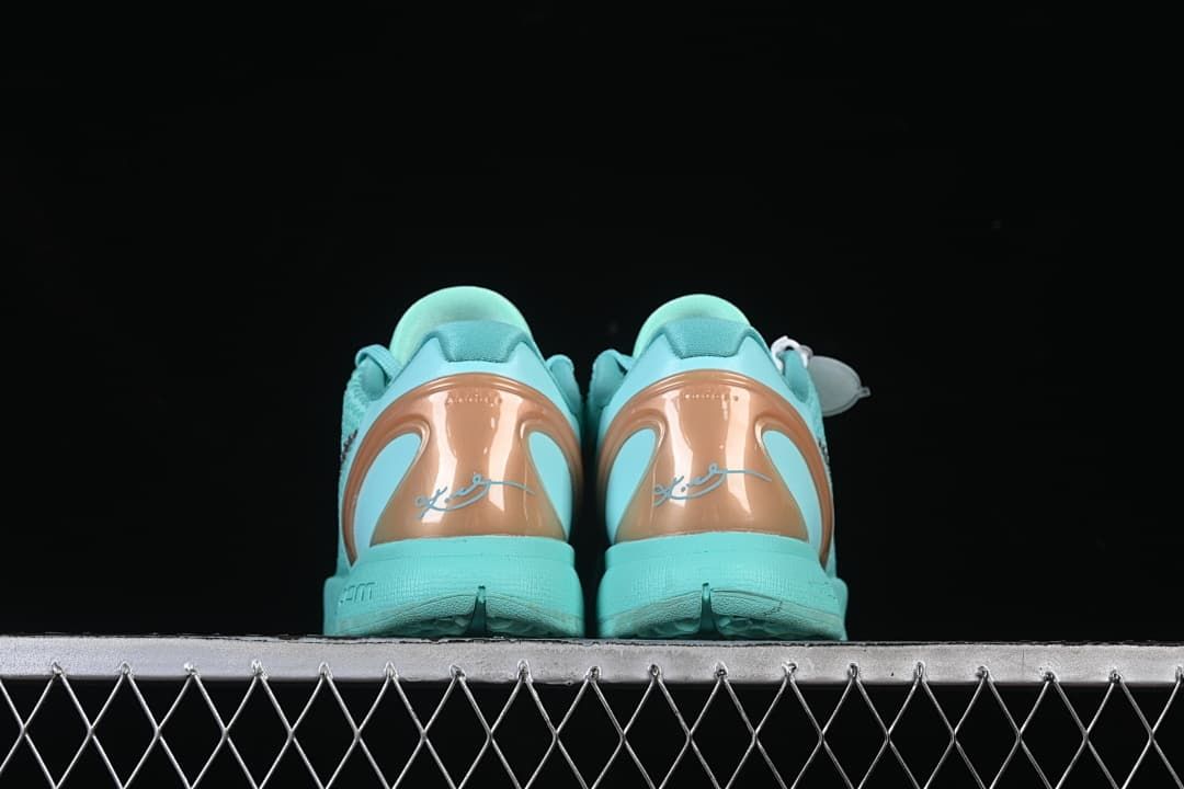 Rear view of the pair with copper-toned heel panels and signature details.