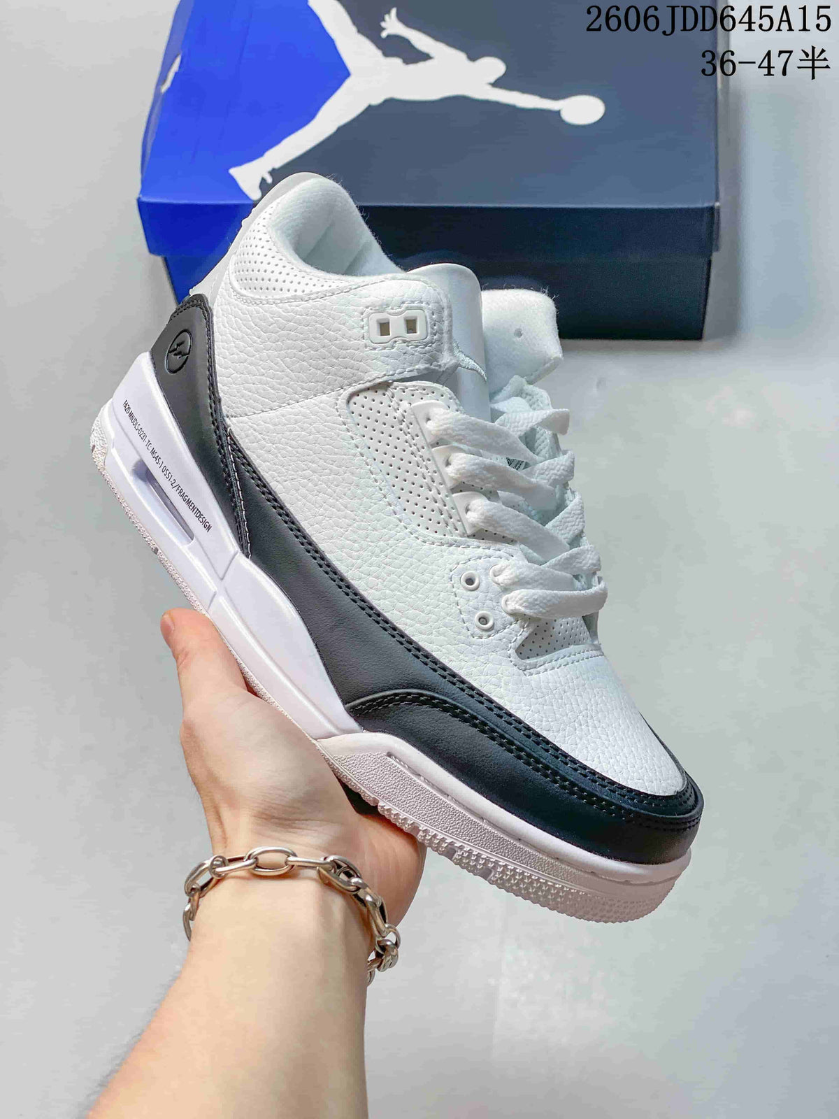Angled side view of a white Air Jordan 3 Retro sneaker