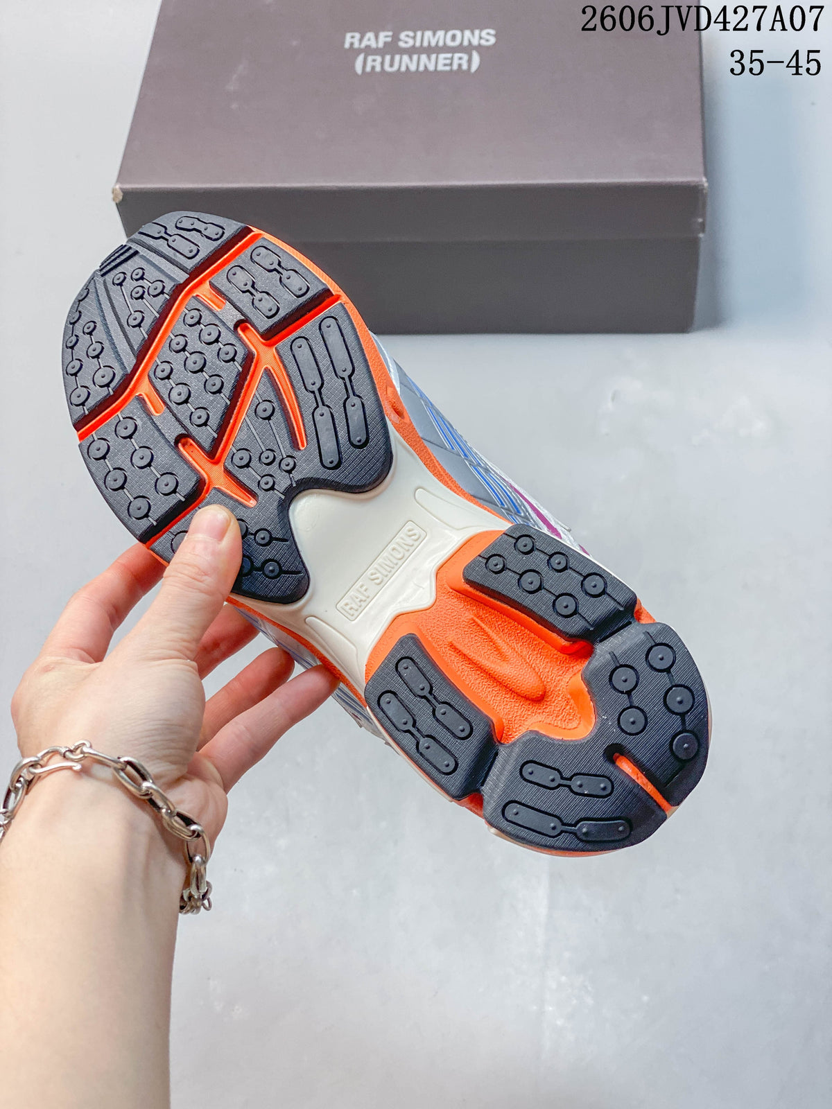 Underside of a sneaker showing a dark patterned outsole with orange sections; box reads Raf Simons Runner, and image overlay shows 35–45.