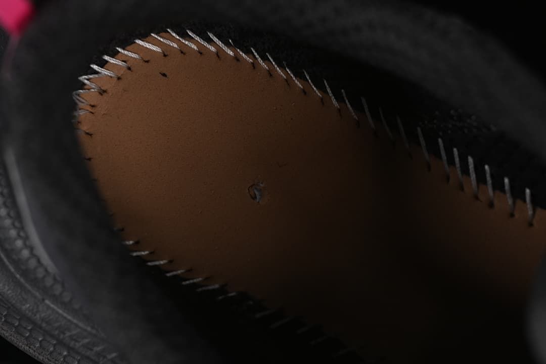 Close-up inside the sneaker showing a stitched interior panel.