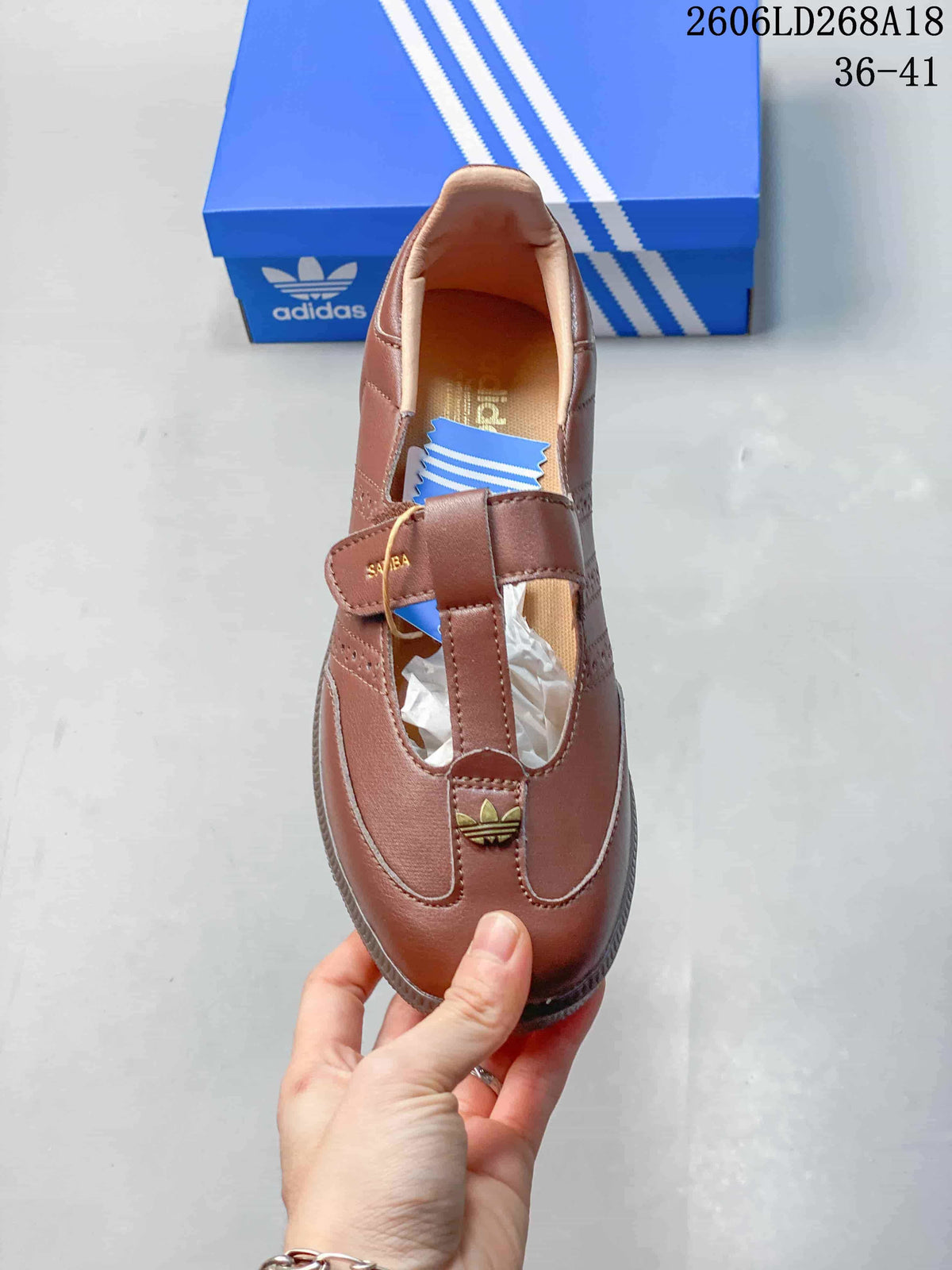 Top view of a brown Samba Jane sneaker showing its strap and gold-tone trefoil accent