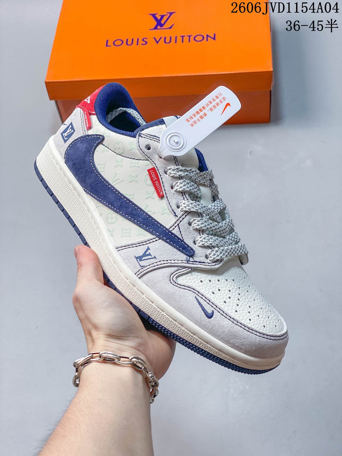 Angled side view of the white, gray, blue and red low-top sneaker.