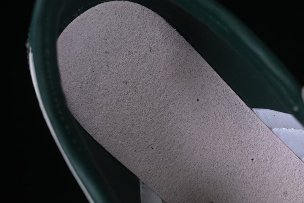 Close-up of the interior footbed and dark green lining