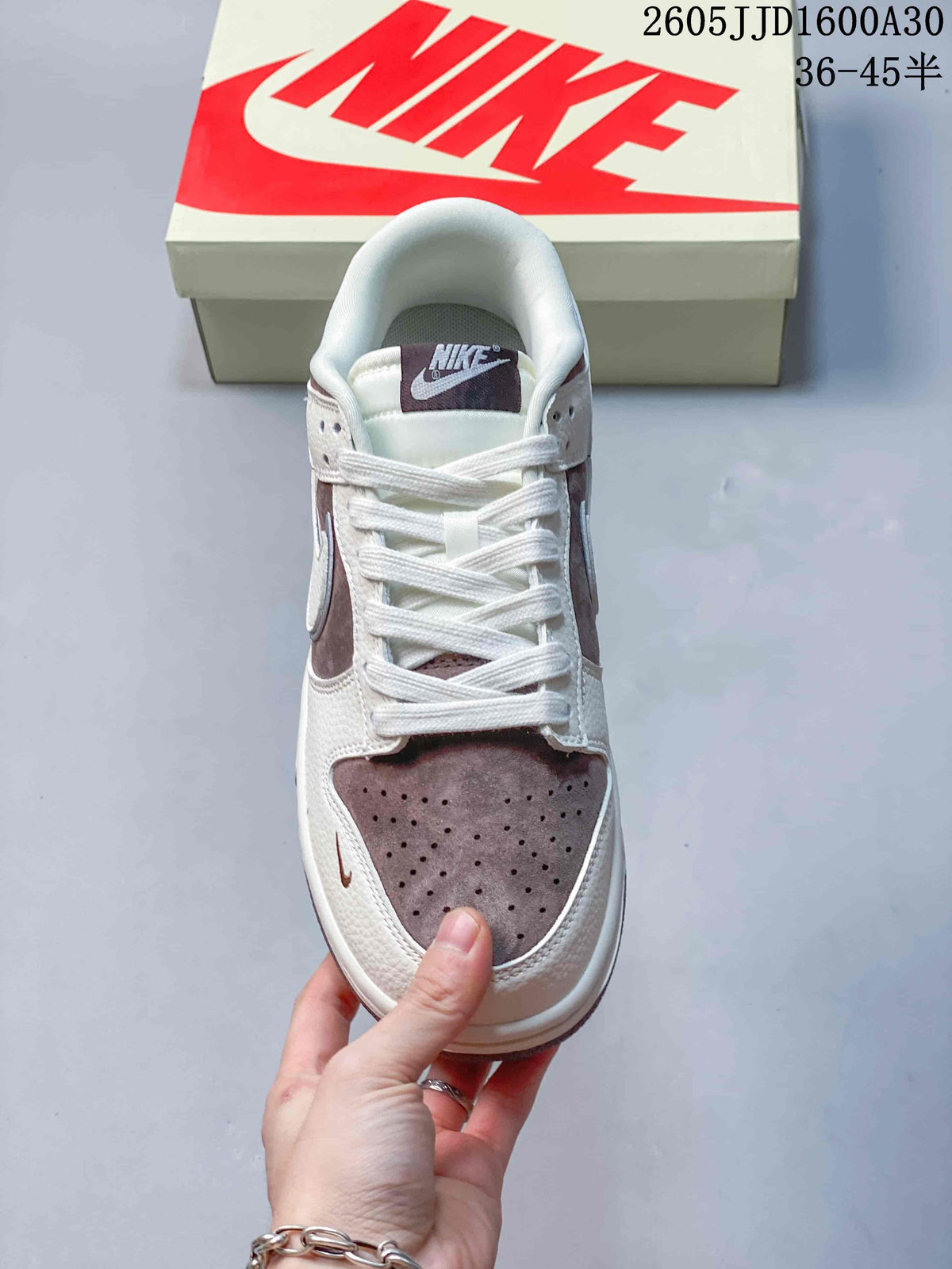 Top view showing perforated toe panel, tongue, and white laces