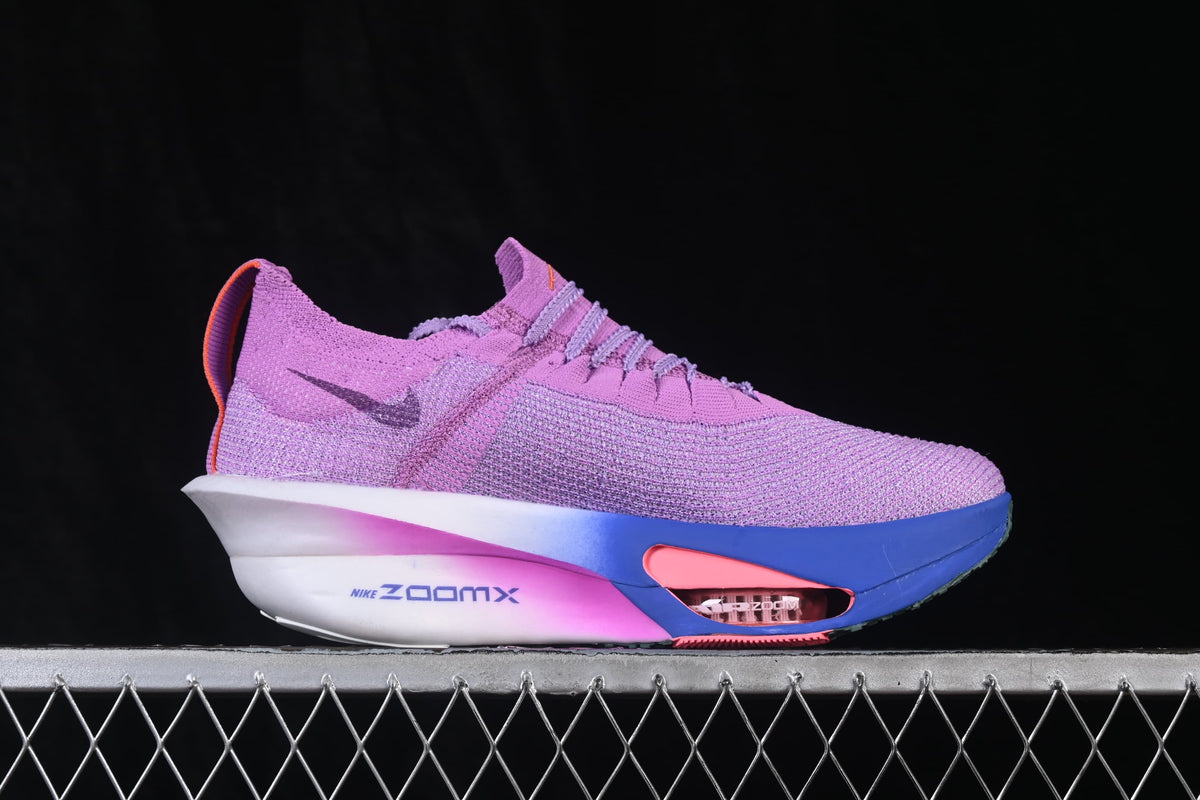 Side profile showing the purple upper and colorful sole accents.