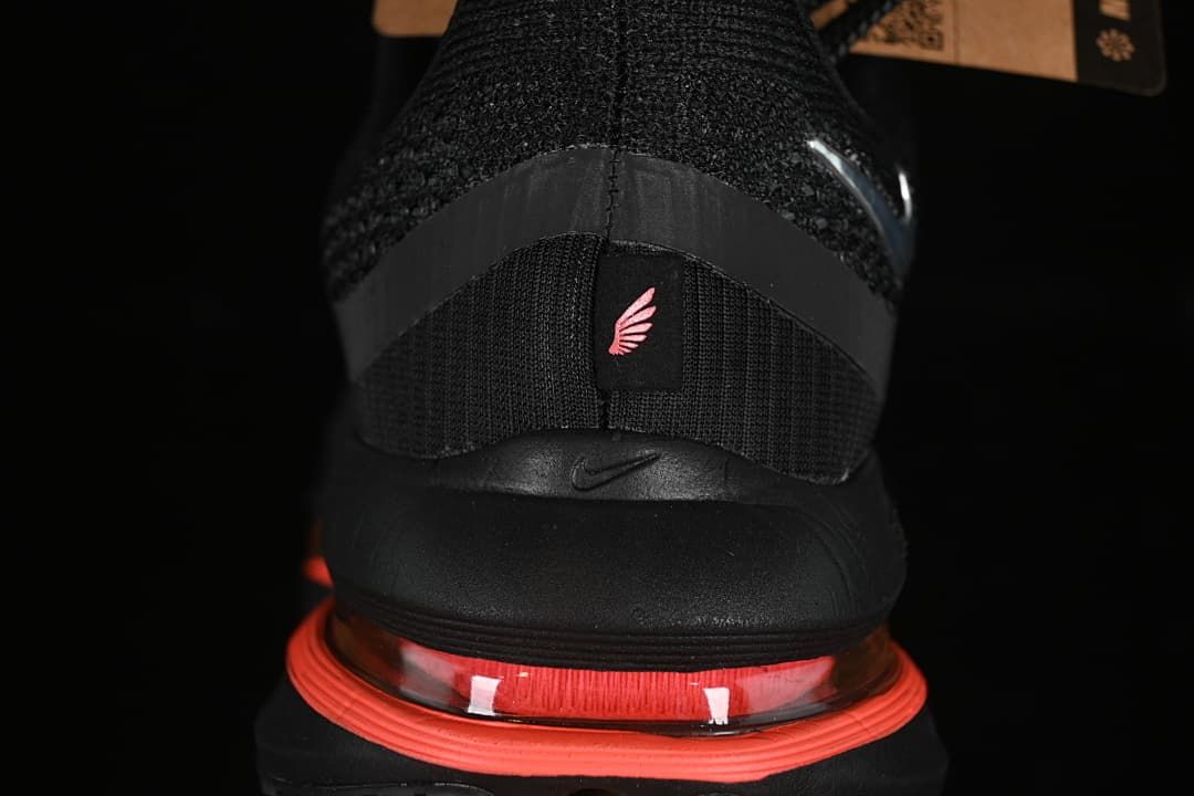 Rear view showing the black heel and coral cushioning unit