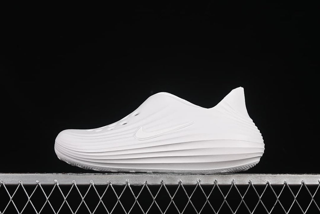 White Nike ReactX Rejuven8 clog shown in side profile