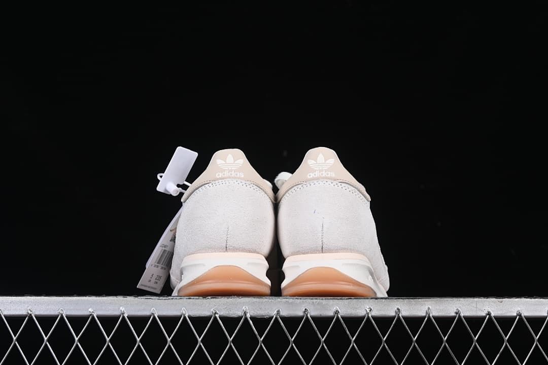 Rear view of both shoes showing beige heel tabs