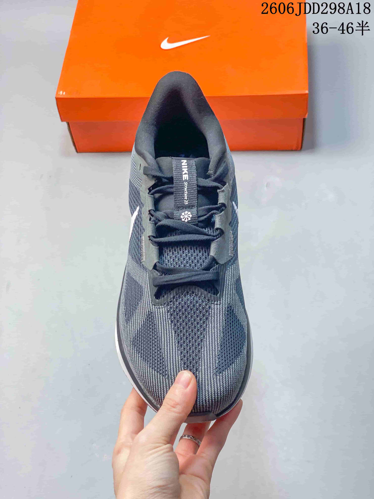 Top view of the gray running shoe showing its laces and tongue label